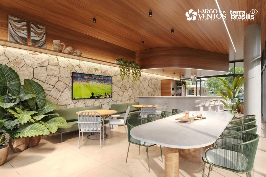 Deck gourmet com televisão, sofás e mesa comunitária